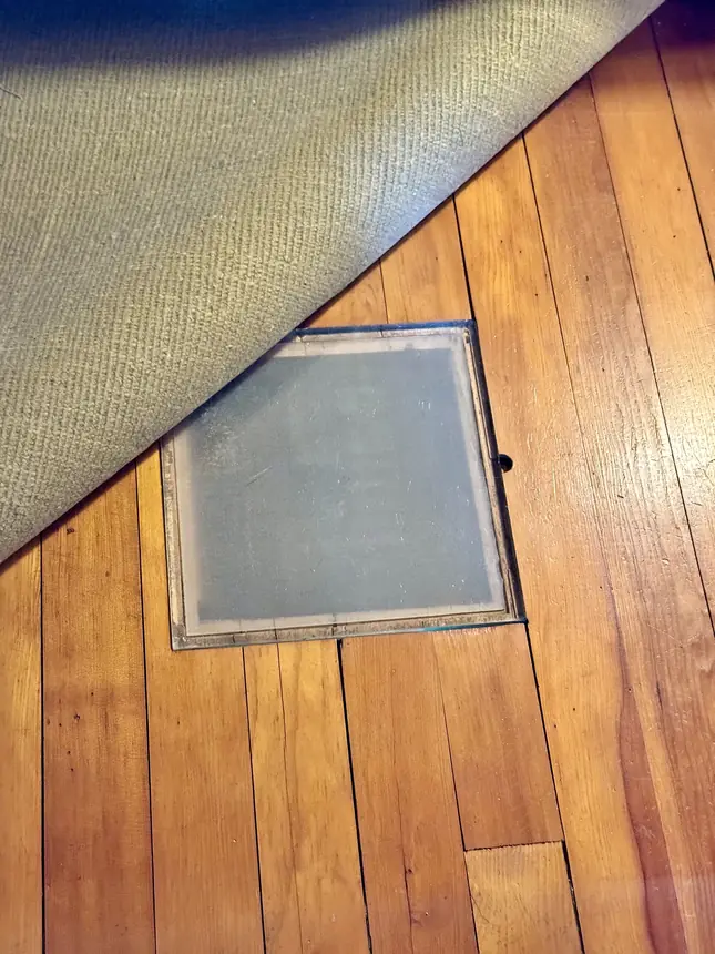 Supply air vent in a bedroom floor