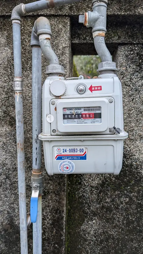 Natural gas meter on the outside wall of a building