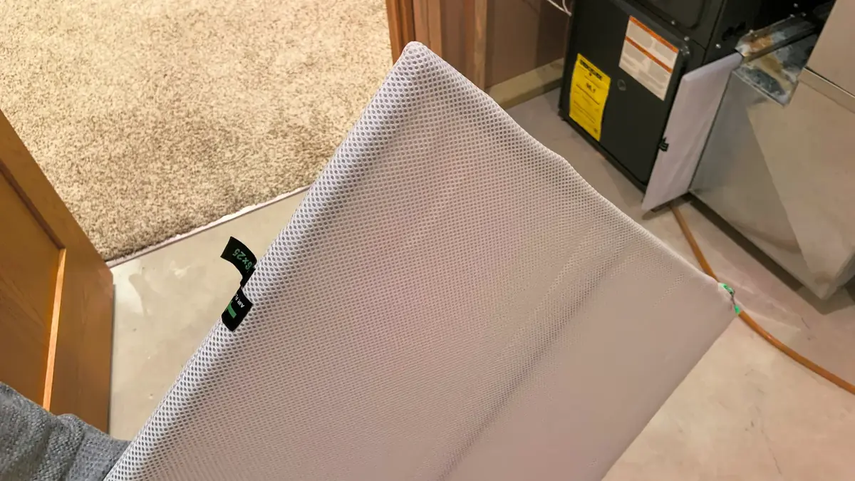Pleated HVAC air filter with a cardboard frame
