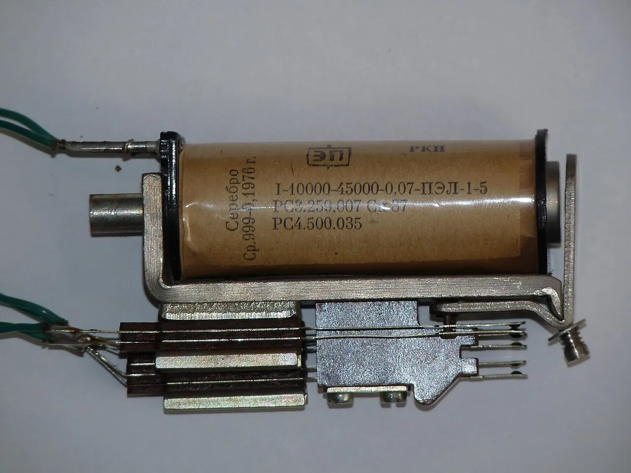 Close-up of a small electromechanical relay with its coil and contacts visible